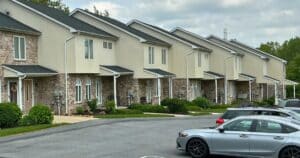 townhome community with shared gutter systems showing where gutter cleaning responsibility may vary